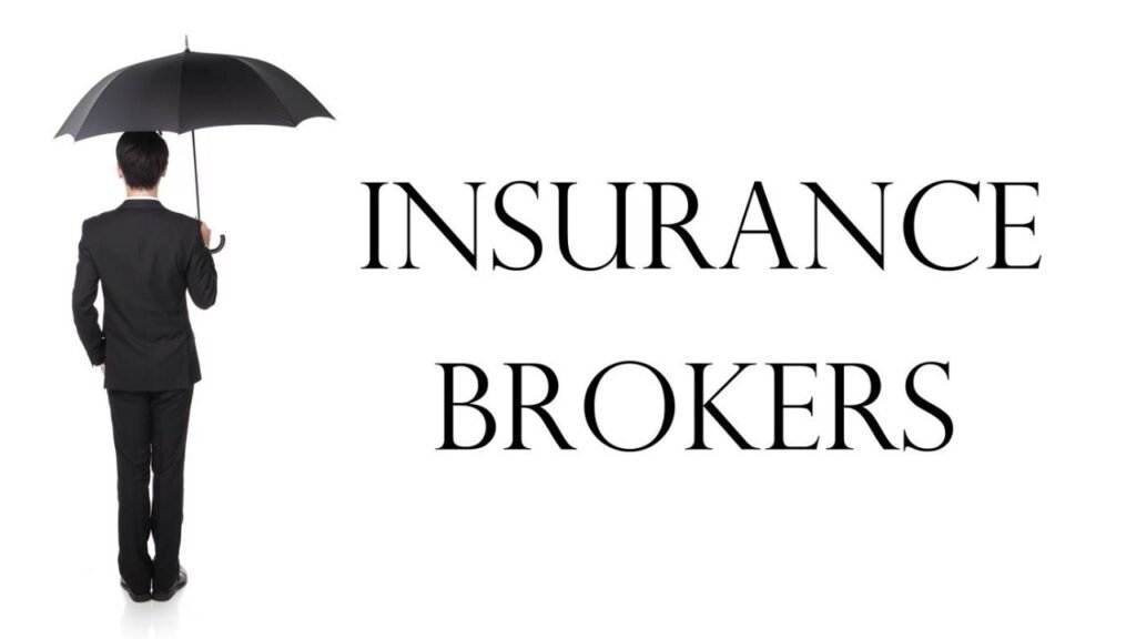 A man in a suit stands holding a black umbrella. Next to him, large text reads INSURANCE BROKERS on a white background.